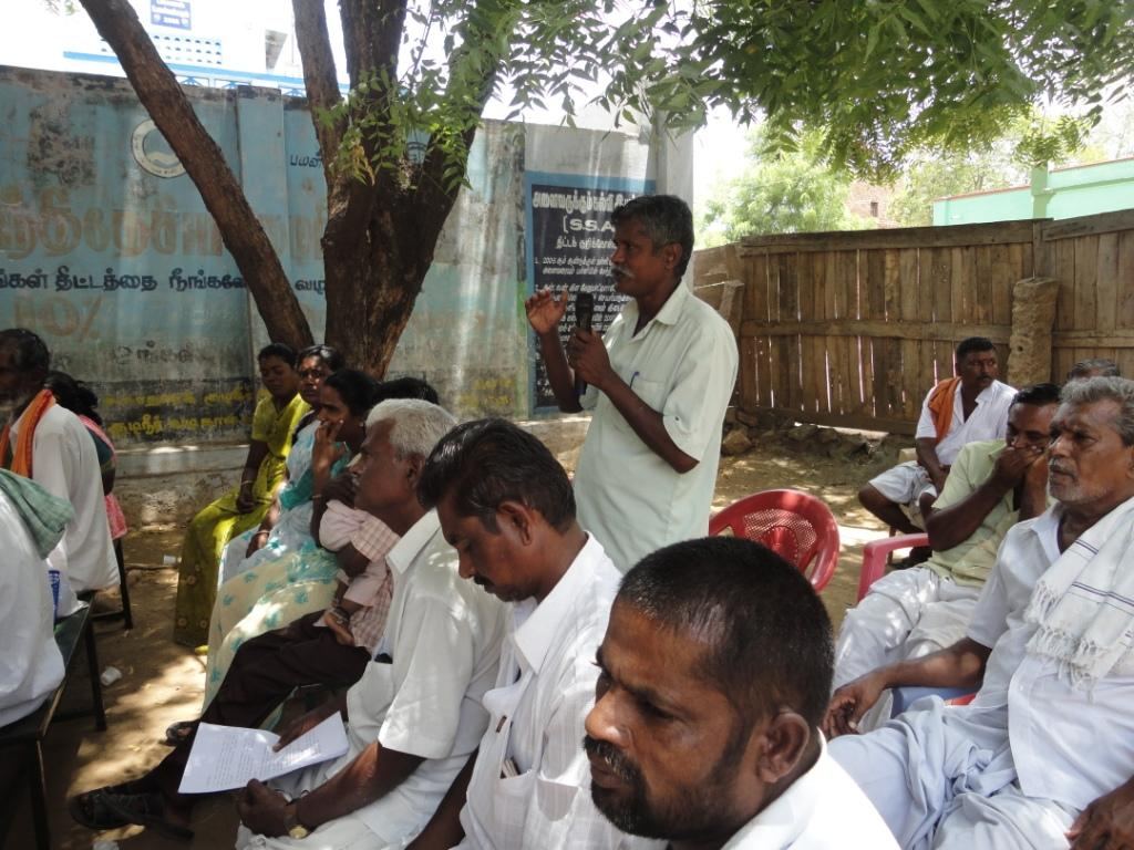 A member addressing a village gathering